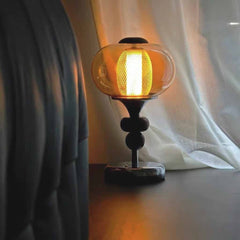 Lampe de table ancien en verre ambré, globe et bois de noyer