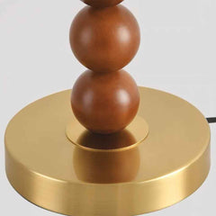 Tischlampe mit Stoffschirm und dekorativer Holzperle